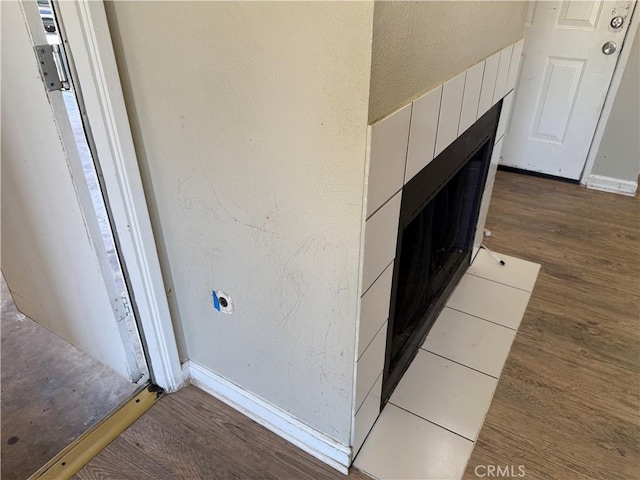 15569 Athol St, Fontana, CA 92335 - detailed view of wood finished floors and a fireplace
