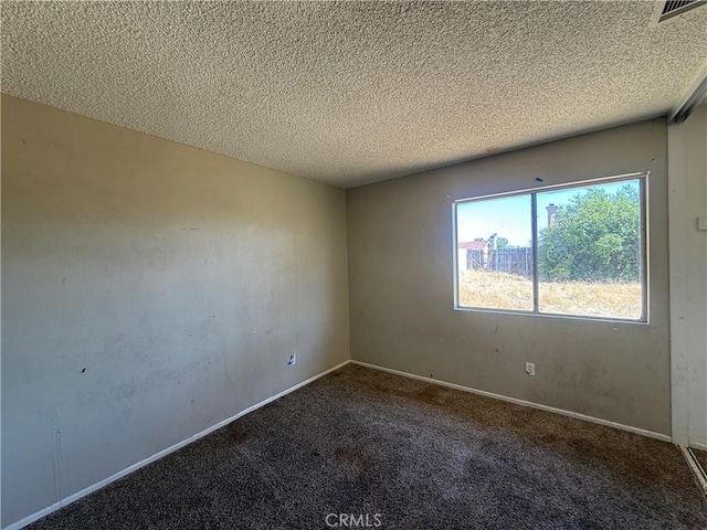 15569 Athol St, Fontana, CA 92335 - carpeted empty room with a textured ceiling