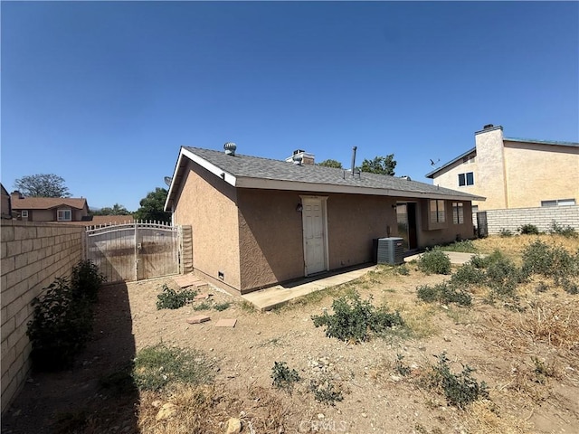 15569 Athol St, Fontana, CA 92335 - back of property featuring a gate and stucco siding
