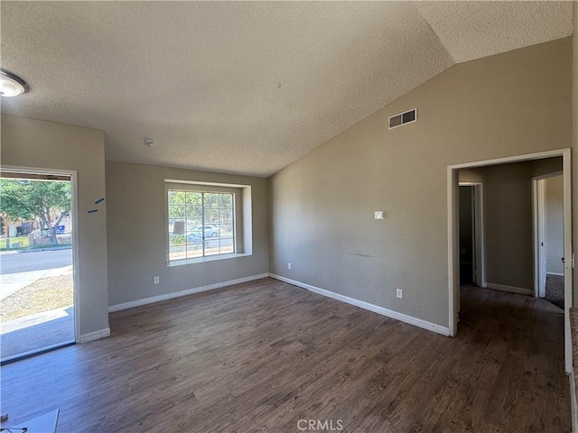 15569 Athol St, Fontana, CA 92335 - spare room featuring a textured ceiling, vaulted ceiling, wood finished floors, and plenty of natural light