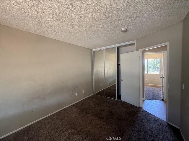 15569 Athol St, Fontana, CA 92335 - unfurnished bedroom with carpet floors, a textured ceiling, and a closet
