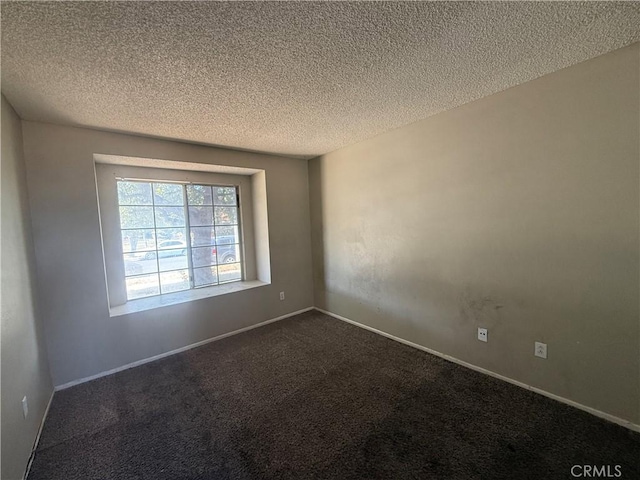 15569 Athol St, Fontana, CA 92335 - unfurnished room with a textured ceiling and dark colored carpet