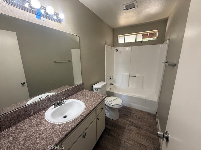 15569 Athol St, Fontana, CA 92335 - bathroom with wood finished floors, vanity, and bathtub / shower combination