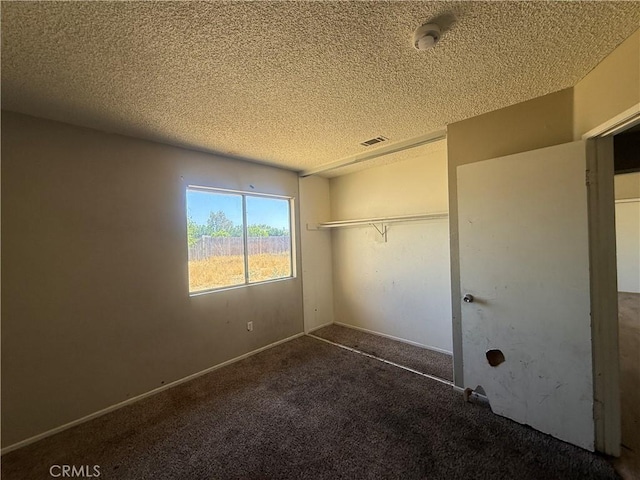 15569 Athol St, Fontana, CA 92335 - unfurnished bedroom featuring a textured ceiling, carpet flooring, and a closet