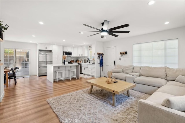10171 Kukui Dr, Huntington Beach, CA 92646 - living room with ceiling fan, recessed lighting, and light wood finished floors