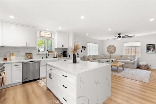 10171 Kukui Dr, Huntington Beach, CA 92646 - kitchen featuring stainless steel dishwasher, recessed lighting, backsplash, a ceiling fan, and light wood-type flooring