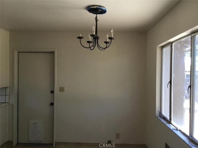 2911 Tahoe Dr, Merced, CA 95340 - spare room with a chandelier and plenty of natural light