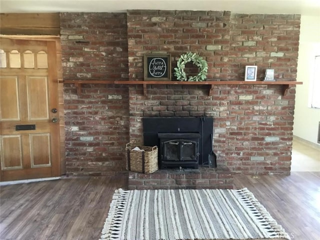 2911 Tahoe Dr, Merced, CA 95340 - unfurnished living room featuring wood finished floors and a wood stove