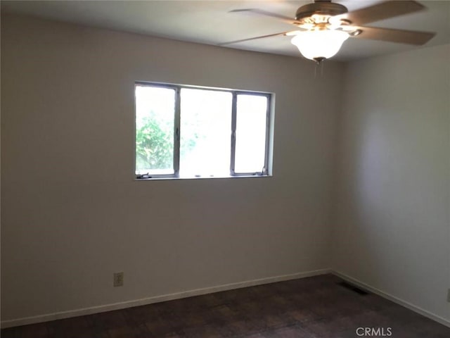 2911 Tahoe Dr, Merced, CA 95340 - empty room with a ceiling fan and baseboards