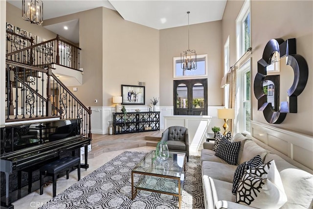 2 Sun Ter, Laguna Niguel, CA 92677 - living area with a chandelier, stairs, a towering ceiling, healthy amount of natural light, and a decorative wall