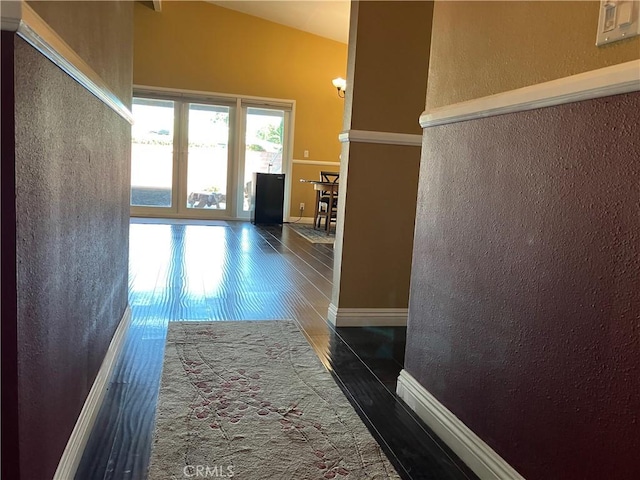 6914 Andasol Ave, Van Nuys, CA 91406 - corridor with a textured wall, wood finished floors, and vaulted ceiling