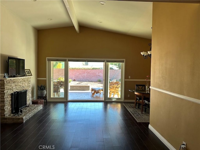 6914 Andasol Ave, Van Nuys, CA 91406 - unfurnished living room featuring dark wood-style flooring, a fireplace, and a chandelier