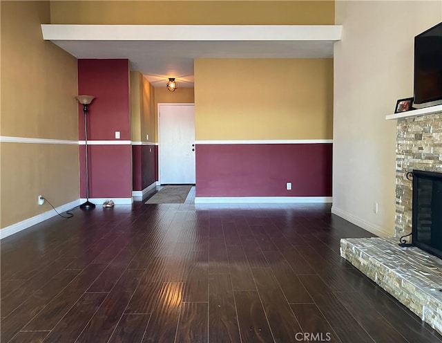 6914 Andasol Ave, Van Nuys, CA 91406 - unfurnished living room featuring a fireplace and wood finished floors