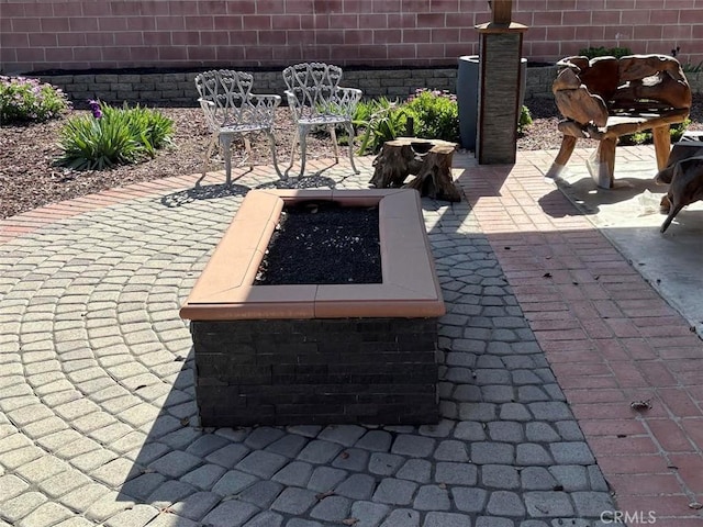 6914 Andasol Ave, Van Nuys, CA 91406 - view of patio with an outdoor fire pit