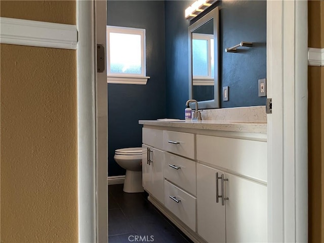 6914 Andasol Ave, Van Nuys, CA 91406 - bathroom with tile patterned flooring, vanity, and a textured wall