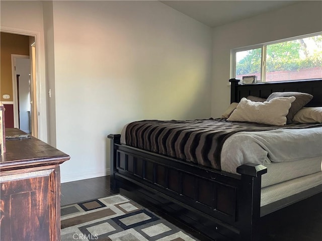 6914 Andasol Ave, Van Nuys, CA 91406 - bedroom featuring baseboards and dark wood-type flooring