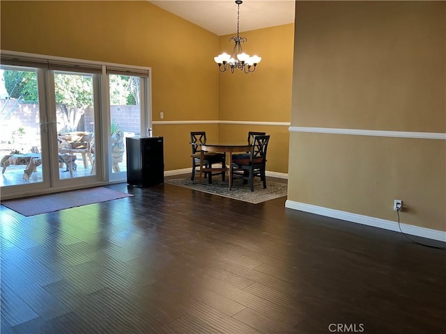 6914 Andasol Ave, Van Nuys, CA 91406 - dining room featuring a chandelier, dark wood-type flooring, and high vaulted ceiling