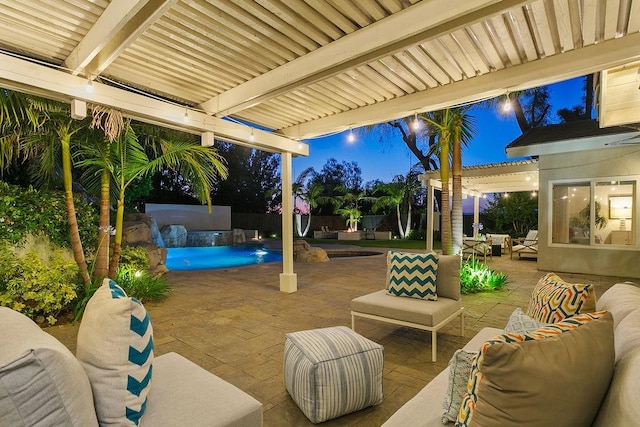 245 S Via Montanera, Anaheim Hills, CA 92807 - patio at night with outdoor lounge area, a patio, an outdoor pool, and a fenced backyard
