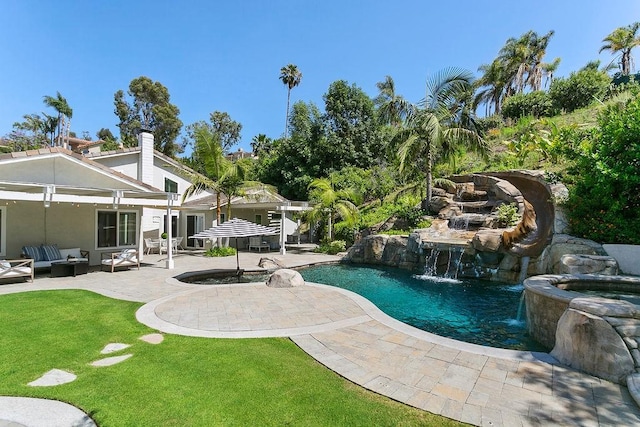 245 S Via Montanera, Anaheim Hills, CA 92807 - view of pool featuring outdoor lounge area, a patio, a pool with connected hot tub, and a yard