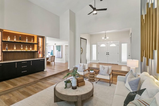 245 S Via Montanera, Anaheim Hills, CA 92807 - living room with high vaulted ceiling, light wood finished floors, ceiling fan, and a chandelier