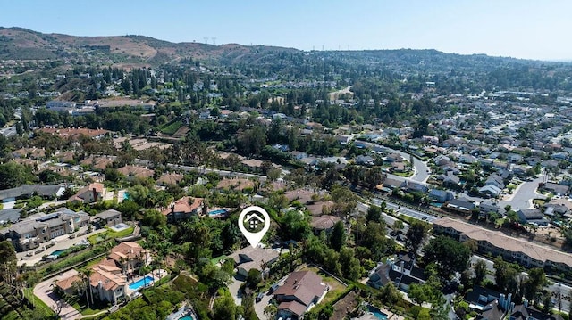 245 S Via Montanera, Anaheim Hills, CA 92807 - aerial view of property and surrounding area with a mountain backdrop and nearby suburban area