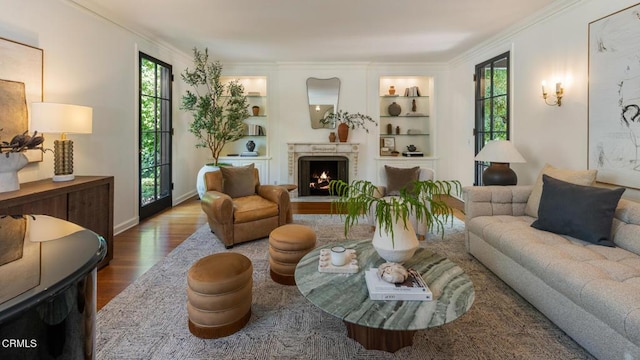 1241 S Oak Knoll Ave, Pasadena, CA 91106 - living room with healthy amount of natural light, wood finished floors, built in shelves, ornamental molding, and a lit fireplace