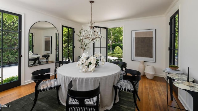 1241 S Oak Knoll Ave, Pasadena, CA 91106 - dining space featuring wood finished floors, plenty of natural light, a chandelier, and ornamental molding