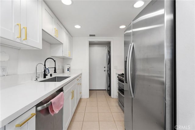 11521 Double Eagle Dr, Whittier, CA 90604 - kitchen featuring stainless steel appliances, white cabinetry, light countertops, light tile patterned floors, and recessed lighting