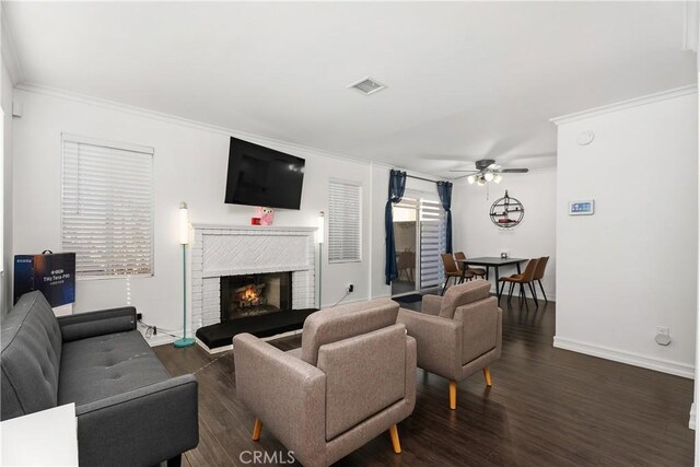 11521 Double Eagle Dr, Whittier, CA 90604 - living room with a ceiling fan, ornamental molding, a brick fireplace, and dark wood-type flooring
