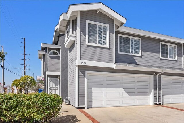 11521 Double Eagle Dr, Whittier, CA 90604 - view of front facade with driveway and an attached garage