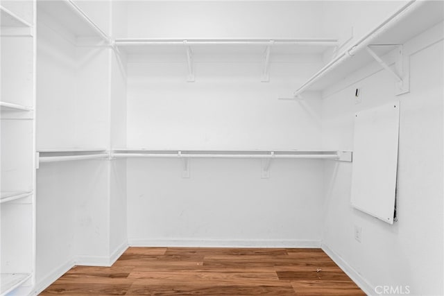 7600 N Courage Way, Van Nuys, CA 91405 - walk in closet featuring wood finished floors