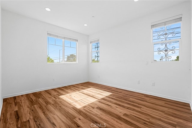 7600 N Courage Way, Van Nuys, CA 91405 - spare room with wood finished floors and recessed lighting