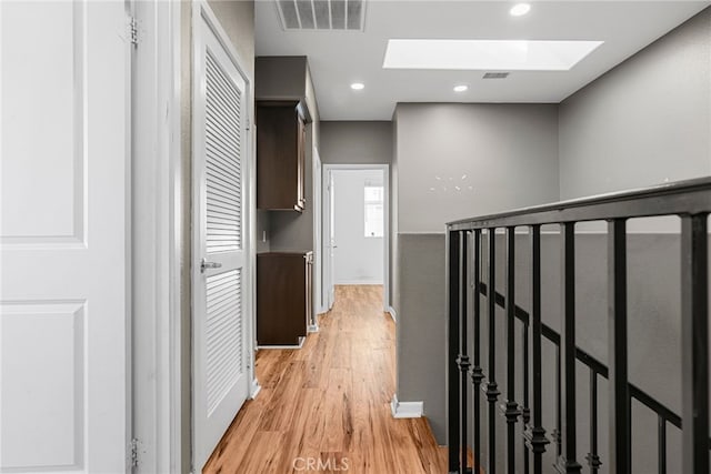 7600 N Courage Way, Van Nuys, CA 91405 - hall featuring a skylight, light wood-type flooring, and recessed lighting