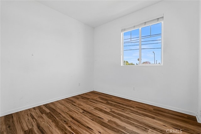 7600 N Courage Way, Van Nuys, CA 91405 - empty room featuring dark wood-style flooring and baseboards