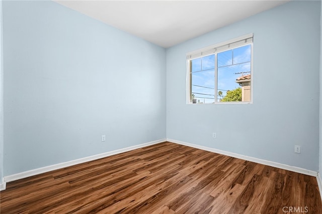7600 N Courage Way, Van Nuys, CA 91405 - spare room with baseboards and wood finished floors