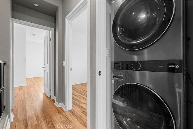 7600 N Courage Way, Van Nuys, CA 91405 - laundry area featuring stacked washer and clothes dryer and light wood-style floors