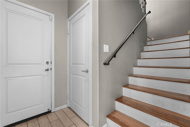 7600 N Courage Way, Van Nuys, CA 91405 - entrance foyer with baseboards and stairway