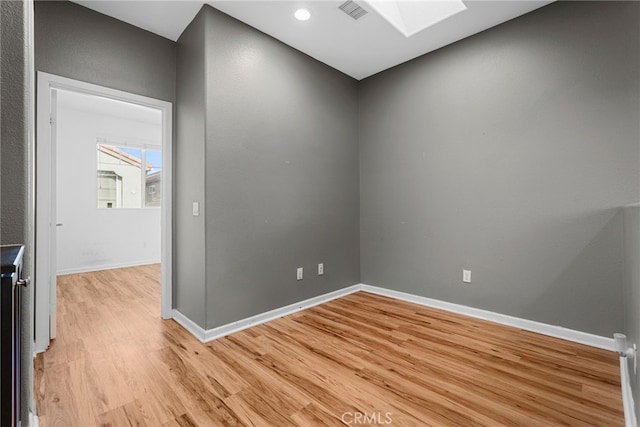 7600 N Courage Way, Van Nuys, CA 91405 - unfurnished room with a skylight and light wood-style flooring