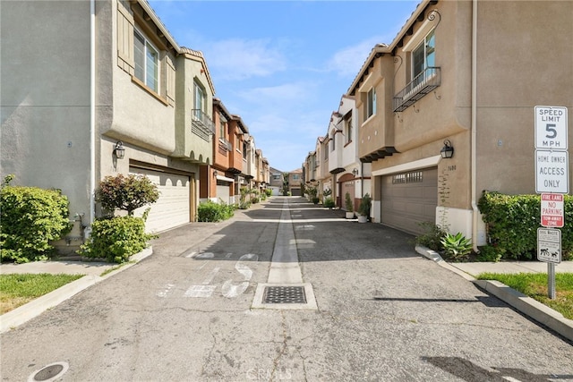 7600 N Courage Way, Van Nuys, CA 91405 - view of asphalt road with a residential view and traffic signs