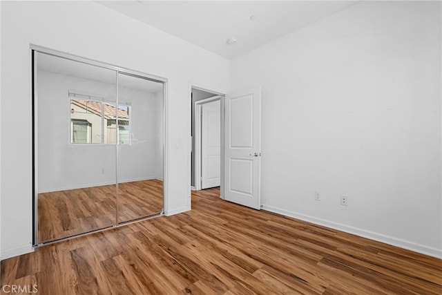 7600 N Courage Way, Van Nuys, CA 91405 - unfurnished bedroom featuring wood finished floors and a closet