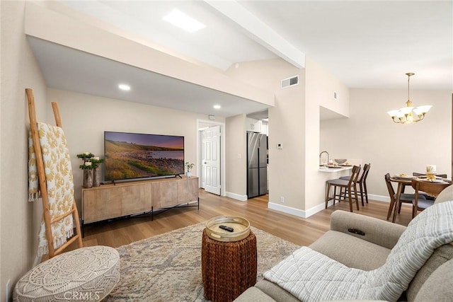 4692 Lakeview Ave Unit 8, Yorba Linda, CA 92886 - living room featuring wood finished floors, a chandelier, and recessed lighting