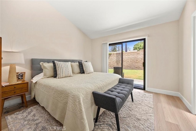 4692 Lakeview Ave Unit 8, Yorba Linda, CA 92886 - bedroom with access to outside, light wood-type flooring, and lofted ceiling
