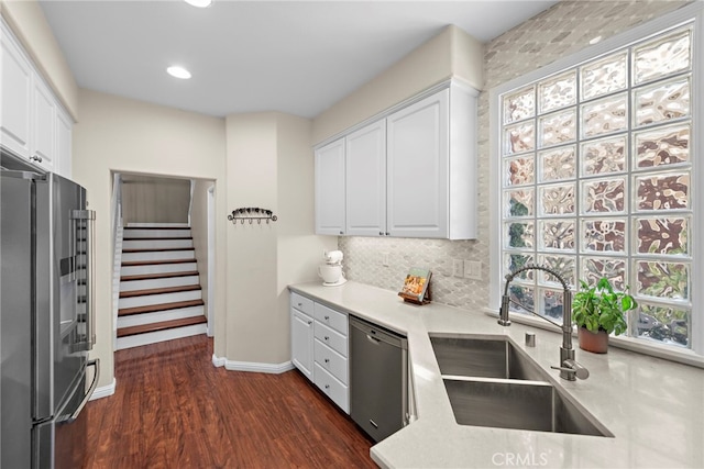 81 Mercantile Way, Ladera Ranch, CA 92694 - kitchen with appliances with stainless steel finishes, white cabinets, dark wood-style flooring, light countertops, and recessed lighting