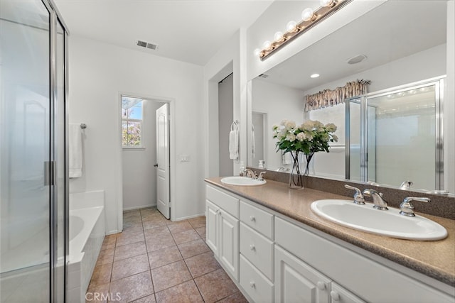 81 Mercantile Way, Ladera Ranch, CA 92694 - bathroom featuring double vanity, a bath, a stall shower, and tile patterned flooring