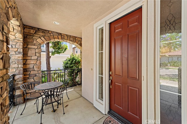 81 Mercantile Way, Ladera Ranch, CA 92694 - view of exterior entry with a porch, stone siding, and stucco siding