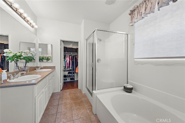 81 Mercantile Way, Ladera Ranch, CA 92694 - bathroom featuring double vanity, a stall shower, a garden tub, and a spacious closet