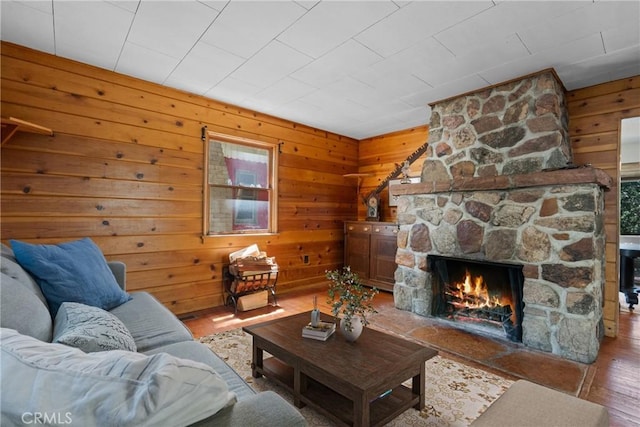 26251 Alpine Ln, Twin Peaks, CA 92391 - living area featuring wood finished floors, wood walls, a fireplace, and plenty of natural light