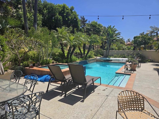 4970 Beauchamp Ct, San Diego, CA 92130 - view of swimming pool with an in-ground hot tub, a patio, and outdoor dining space