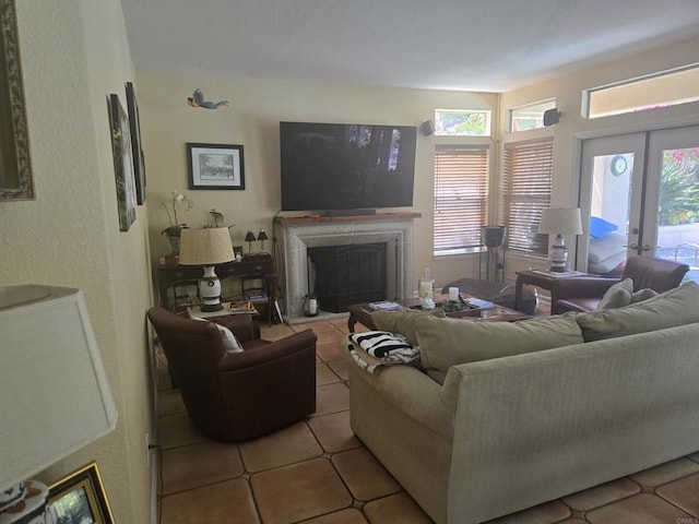 4970 Beauchamp Ct, San Diego, CA 92130 - tiled living area featuring a fireplace with raised hearth, plenty of natural light, french doors, and a textured wall