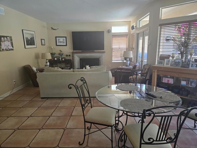 4970 Beauchamp Ct, San Diego, CA 92130 - dining area with a fireplace and tile patterned flooring